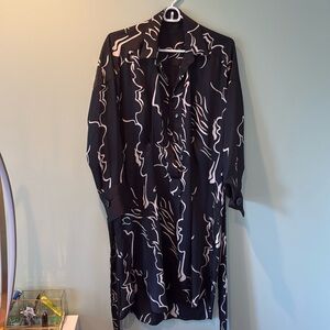 Women’s black midi patterned dress.